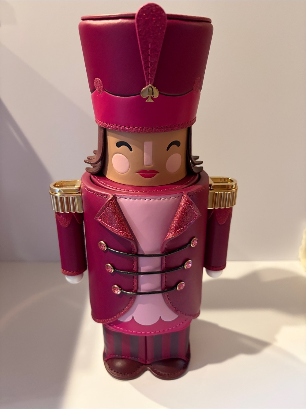 kate spade pink and light pink nutcracker figurine with gold accents